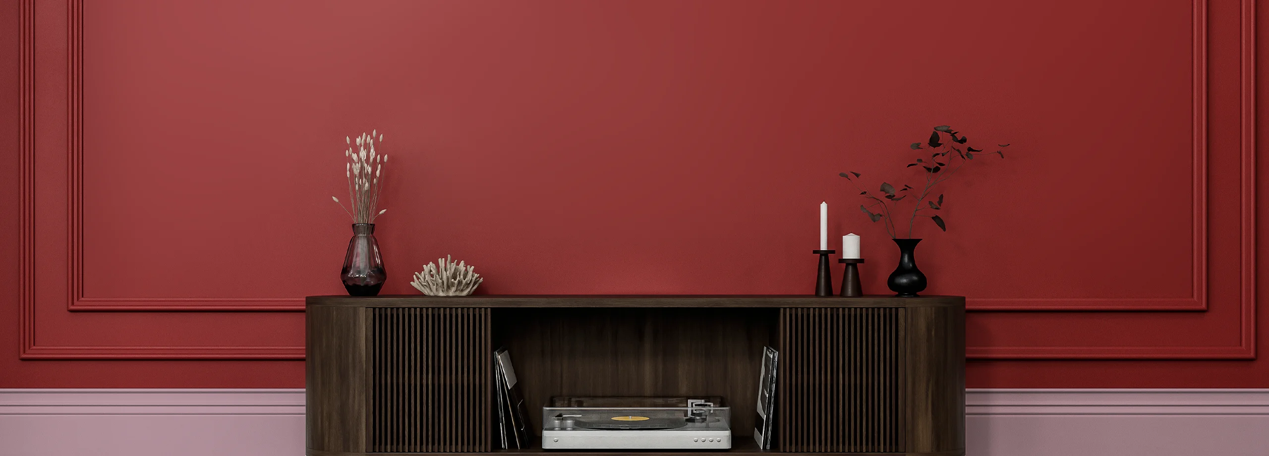 Stylish living room featuring a rich red wall painted with Nippon Paint, complemented by a modern wooden cabinet, decorative vases, and a vintage record player.