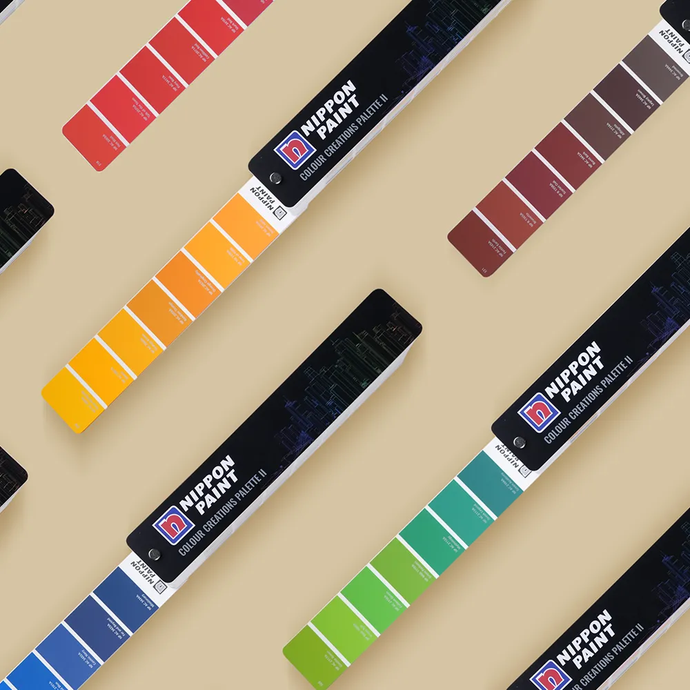 Various colour fandecks lying flat on white floor