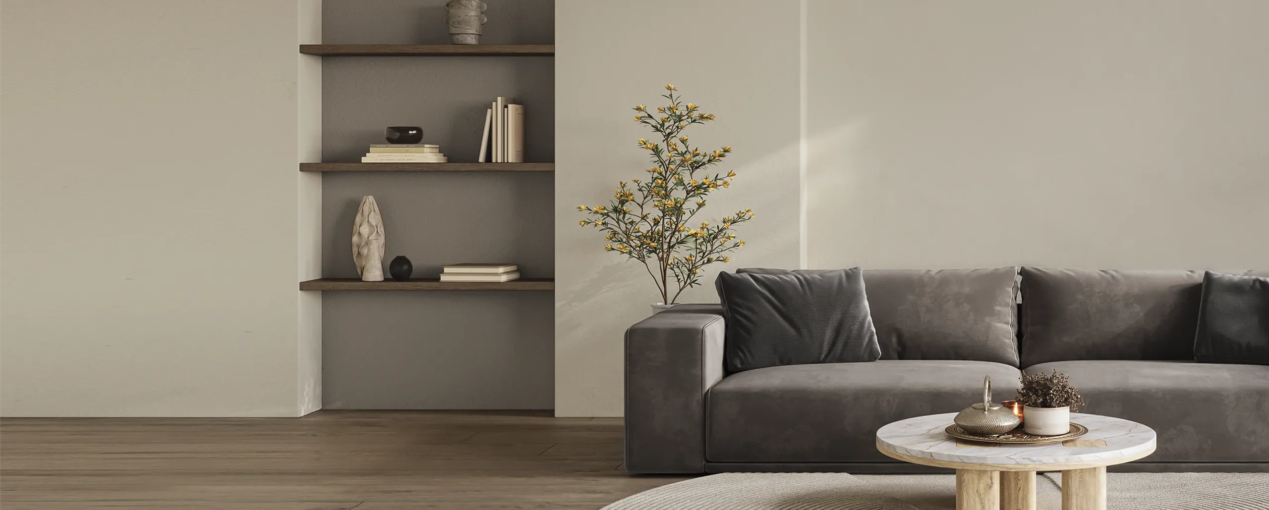 Grey sofa and side table placed in front of beige interior wall with shelves
