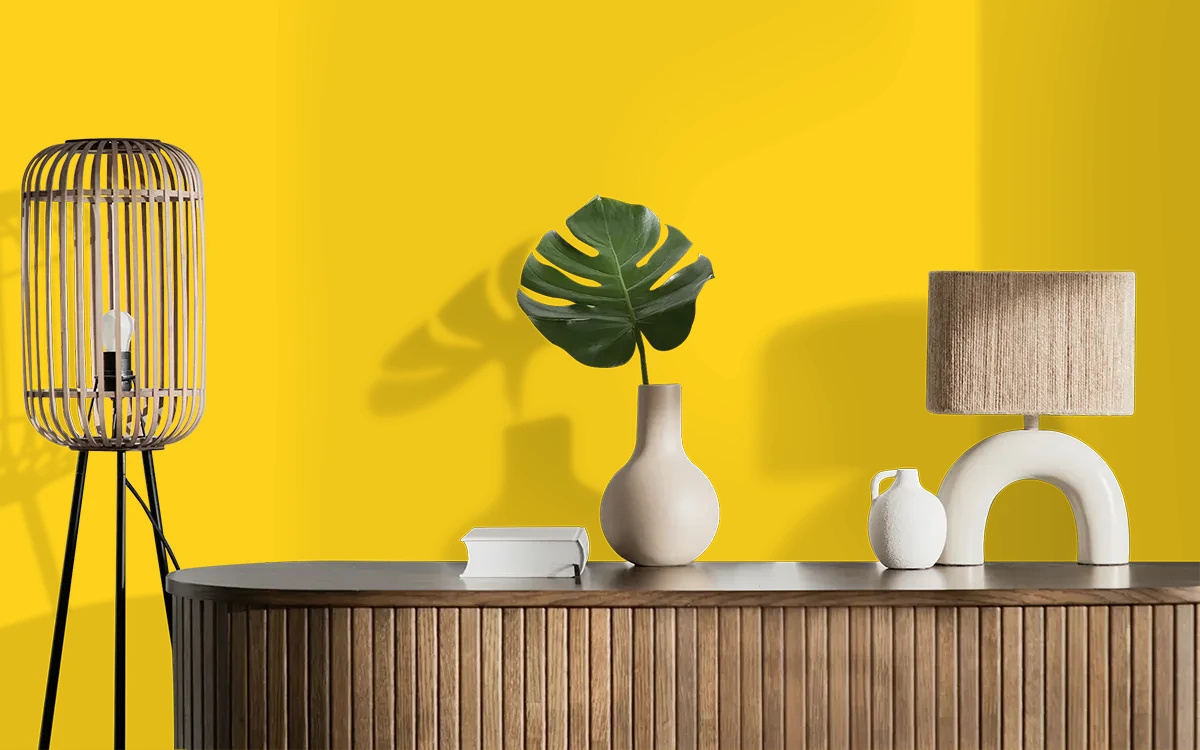 Nippon Paint's ABSOLUTE YELLOW color on different wall surfaces.