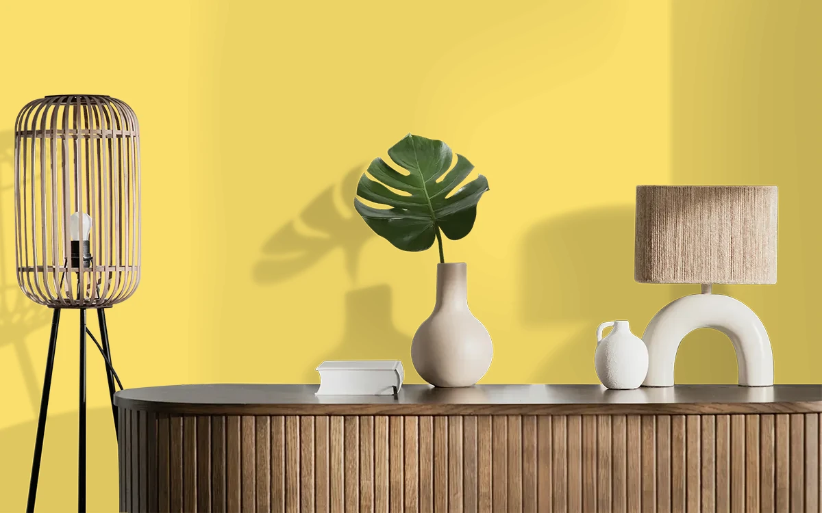 Nippon Paint's AUSTERE YELLOW color on different wall surfaces.