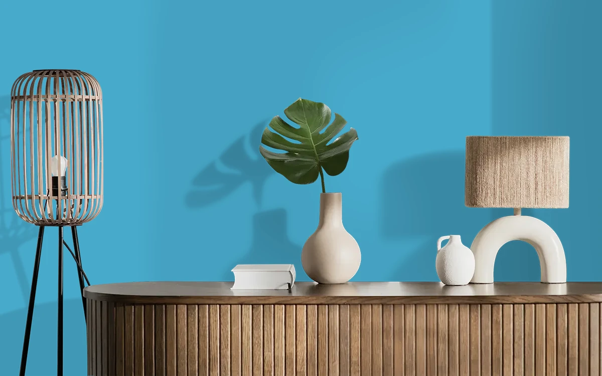 Nippon Paint's AUSTRIA BLUE color on different wall surfaces.
