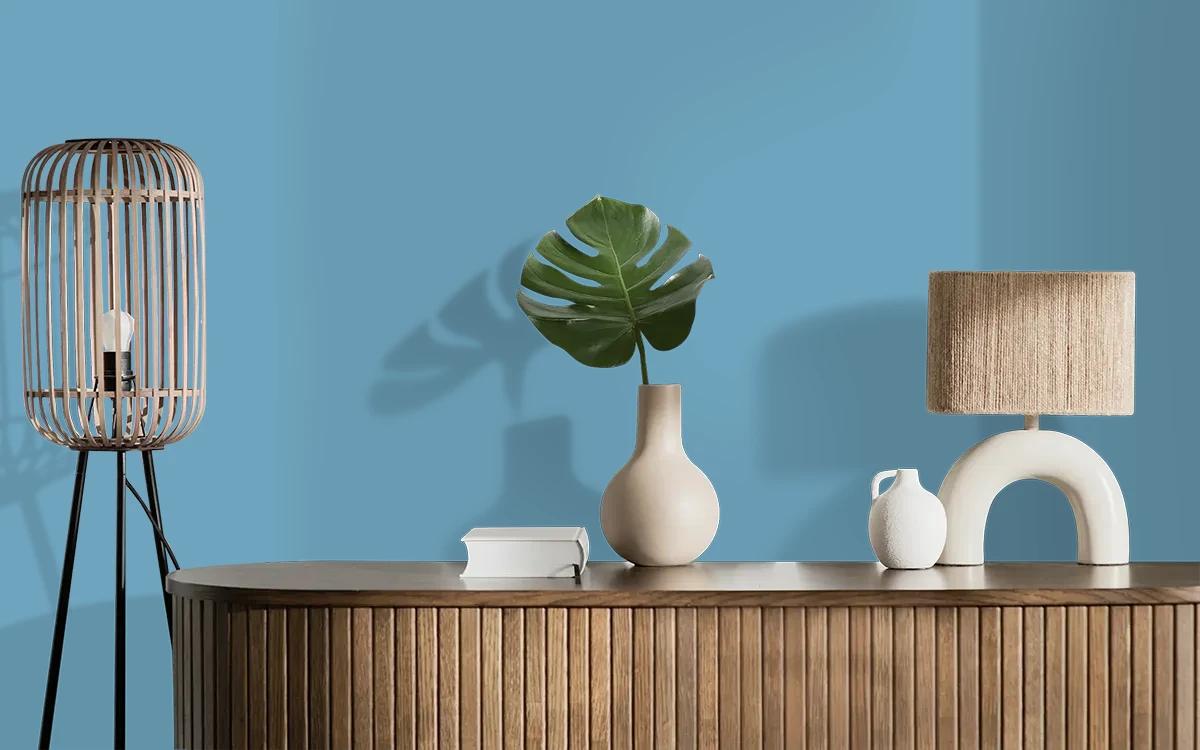 Nippon Paint's BLUE BUTTON color on different wall surfaces.