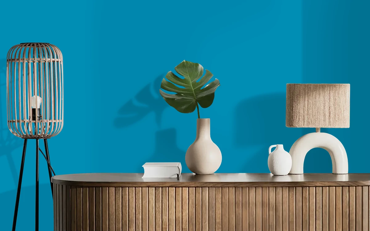 Nippon Paint's BLUE HATCH color on different wall surfaces.
