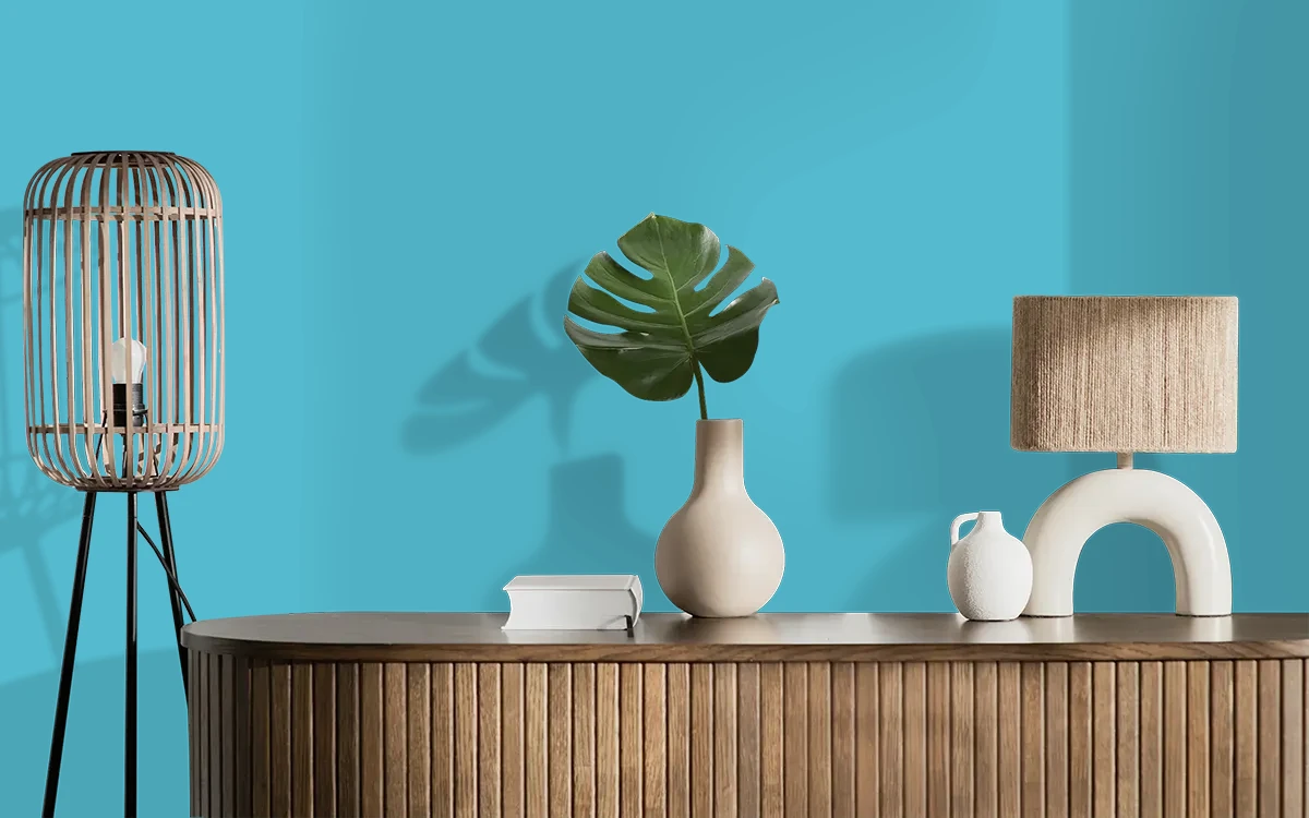 Nippon Paint's BLUE TASSLE color on different wall surfaces.