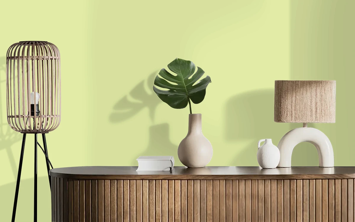 Nippon Paint's BUDDING LIME color on different wall surfaces.