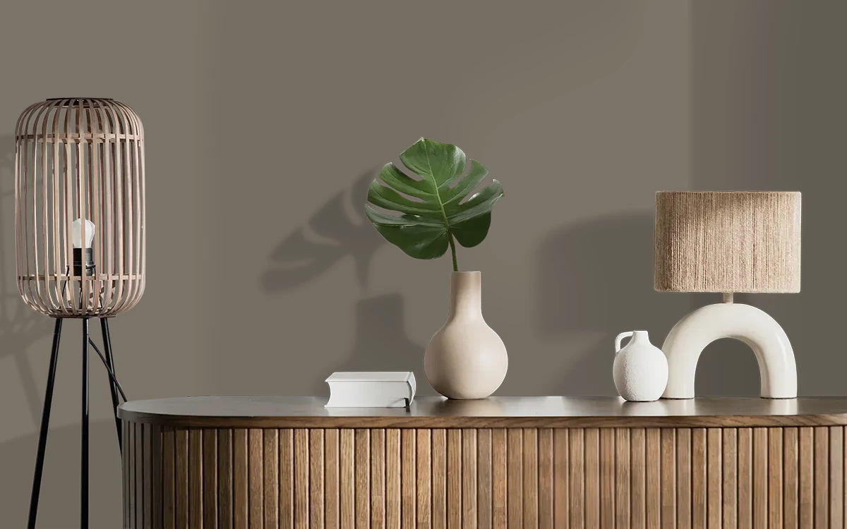 Nippon Paint's BURNISHED BRASS color on different wall surfaces.