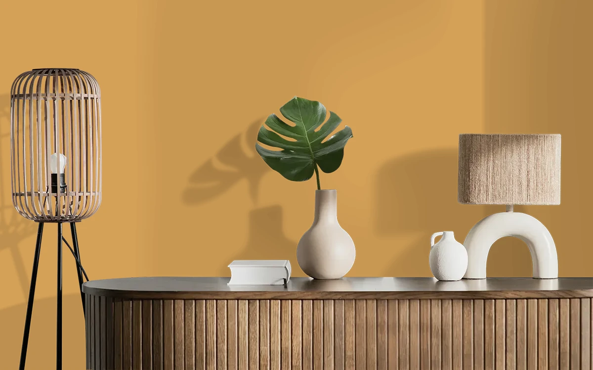 Nippon Paint's CAPITOL'S GOLD color on different wall surfaces.