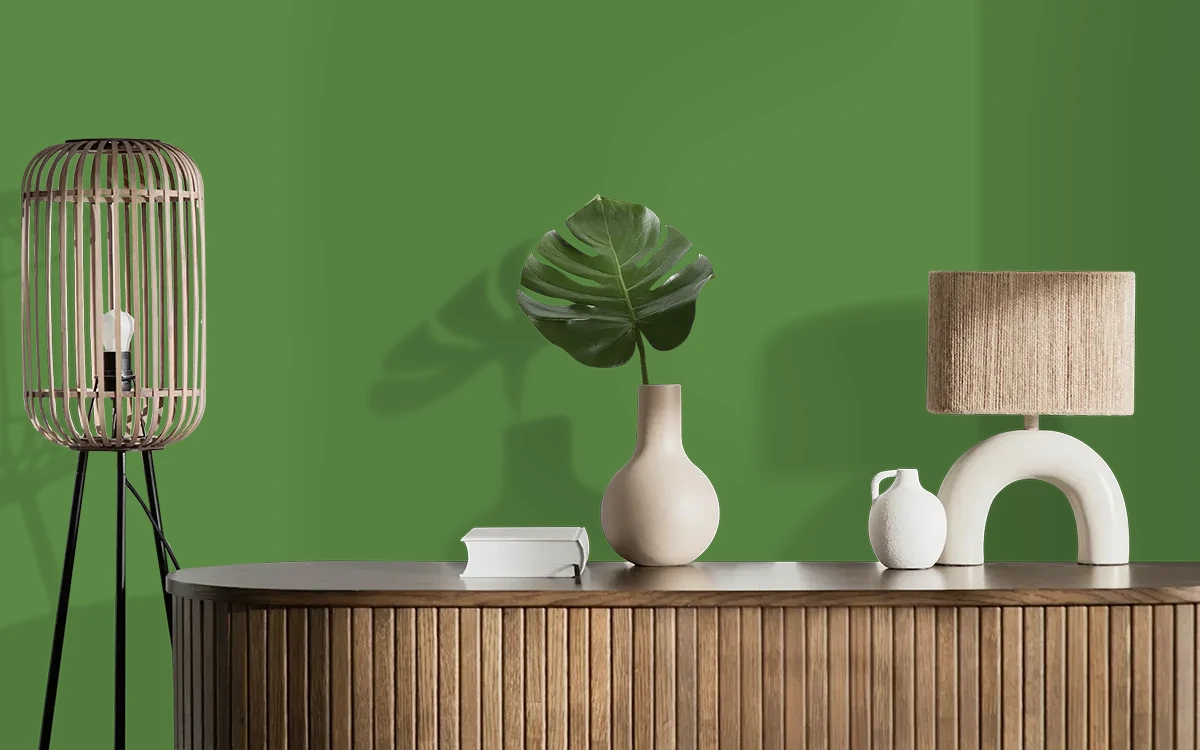 Nippon Paint's CLIMBING VINE color on different wall surfaces.