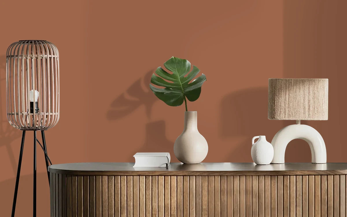 Nippon Paint's COPPER BELL color on different wall surfaces.