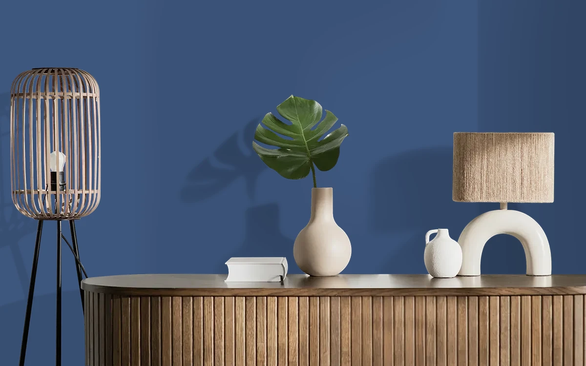Nippon Paint's COSMIC NAVY color on different wall surfaces.