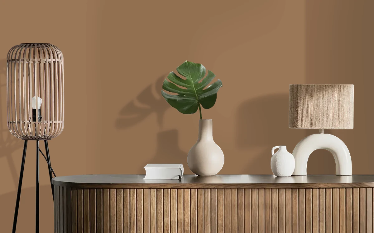 Nippon Paint's COUNTRY MAPLE color on different wall surfaces.