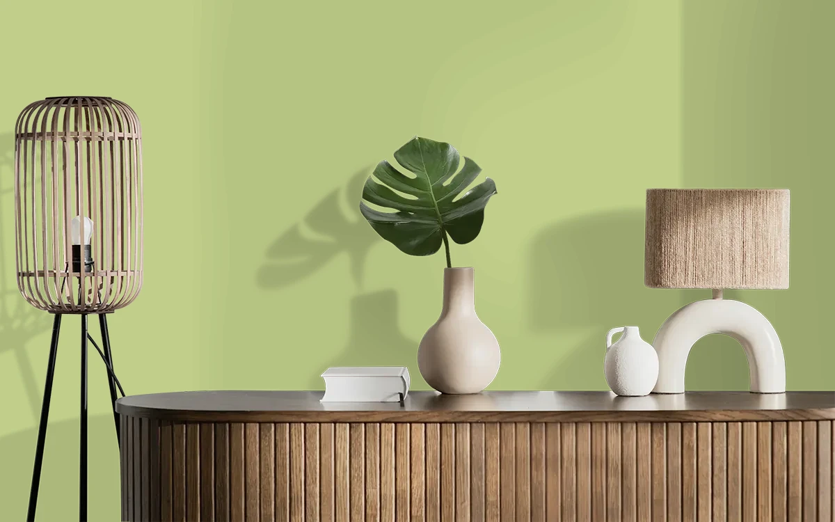 Nippon Paint's CREEPING WILLOW color on different wall surfaces.