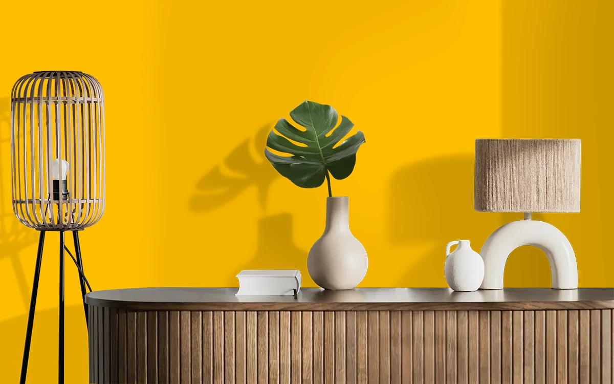 Nippon Paint's DEEP MARIGOLDS color on different wall surfaces.