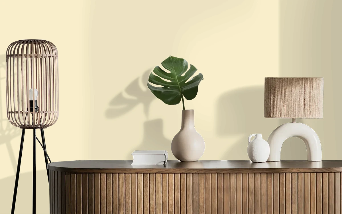 Nippon Paint's EARLY SUNSHINE color on different wall surfaces.