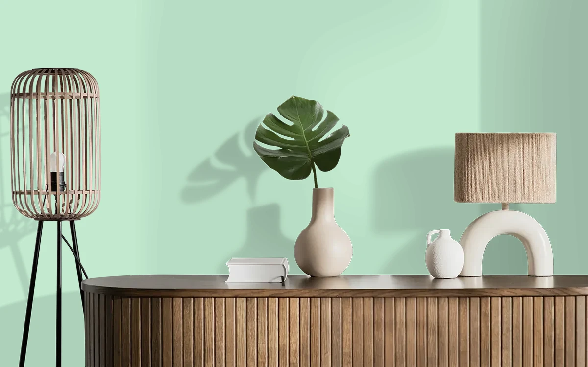 Nippon Paint's EVERGREEN AURA color on different wall surfaces.