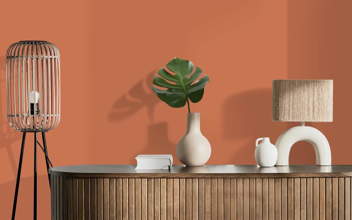 Nippon Paint's FIREBUSH color on different wall surfaces.
