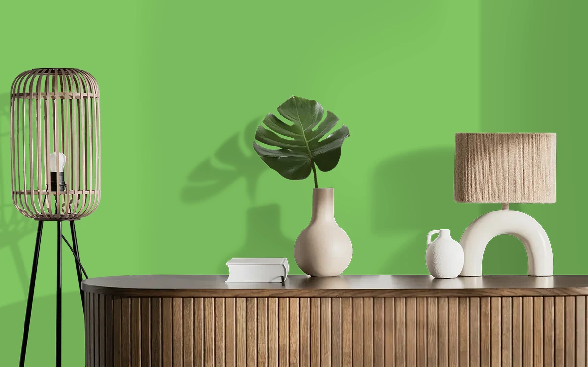 Nippon Paint's FROLIC GREEN color on different wall surfaces.