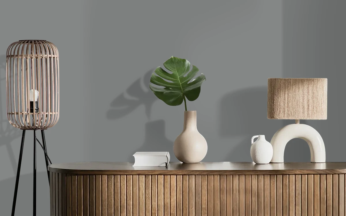 Nippon Paint's GRAY SWEATSHIRT color on different wall surfaces.