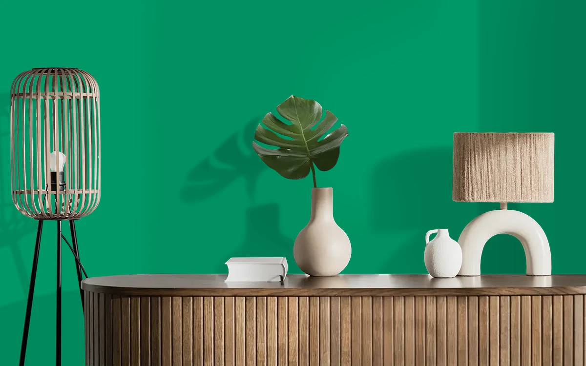Nippon Paint's GREEN BARRICADES color on different wall surfaces.