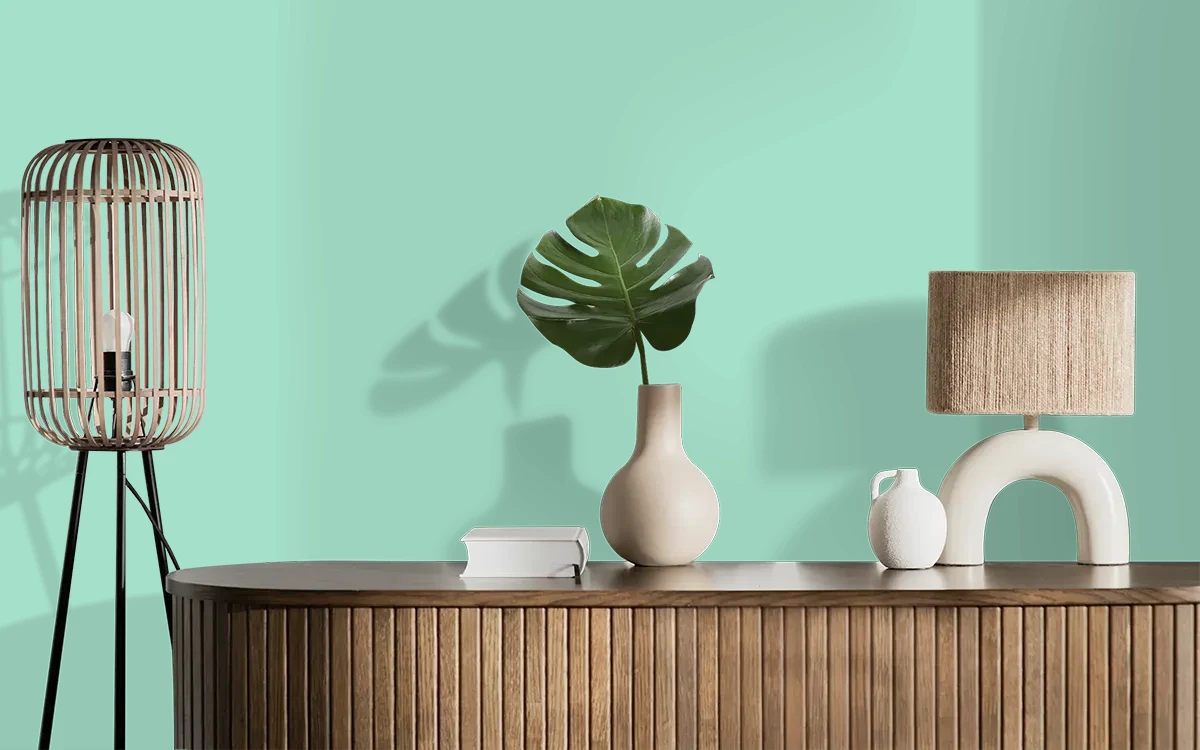 Nippon Paint's GUSTAV GREEN color on different wall surfaces.