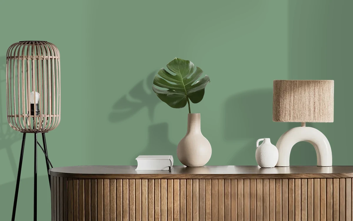 Nippon Paint's HIMALAYAN GREEN color on different wall surfaces.