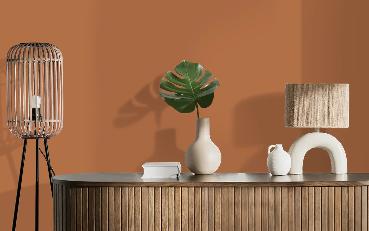 Nippon Paint's HONEY CARAMEL color on different wall surfaces.
