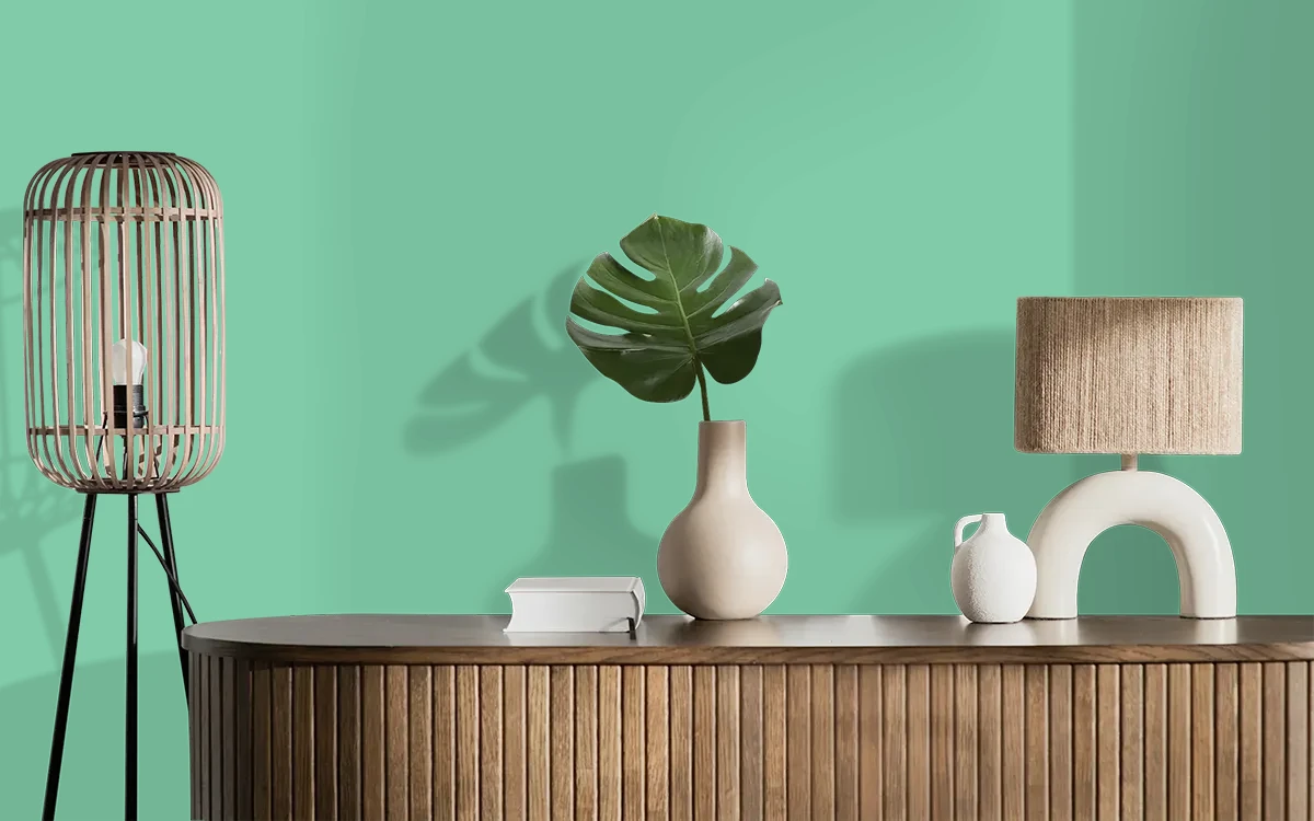 Nippon Paint's HUNTER ZING color on different wall surfaces.