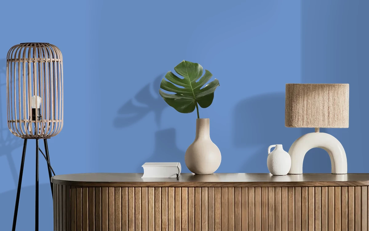 Nippon Paint's JOVIAL BLUE color on different wall surfaces.