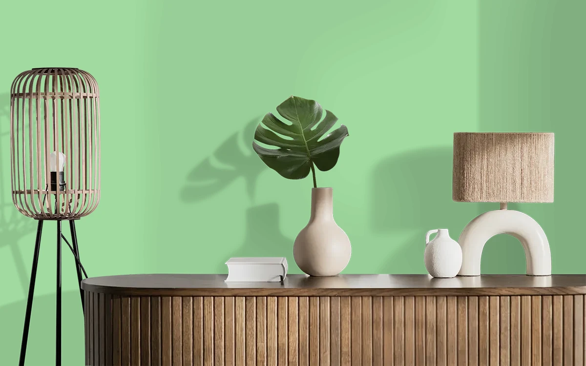 Nippon Paint's KIWI SMOOTHIE color on different wall surfaces.