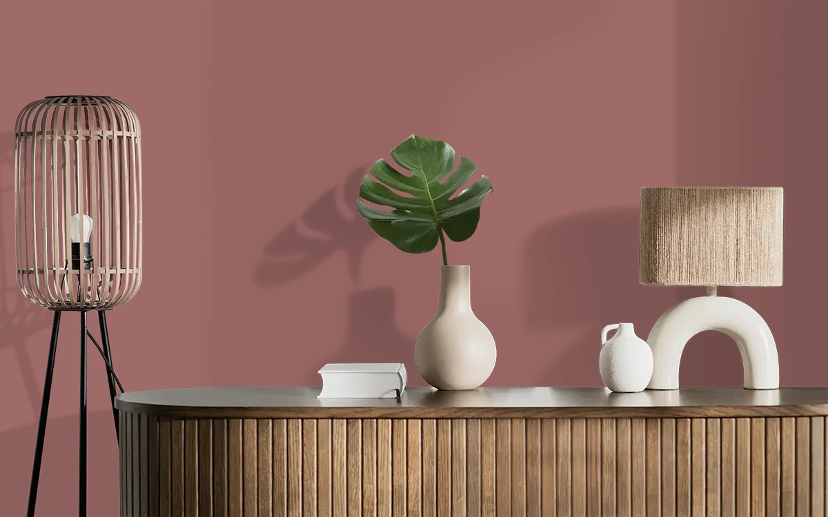 Nippon Paint's MAROON GLOW color on different wall surfaces.