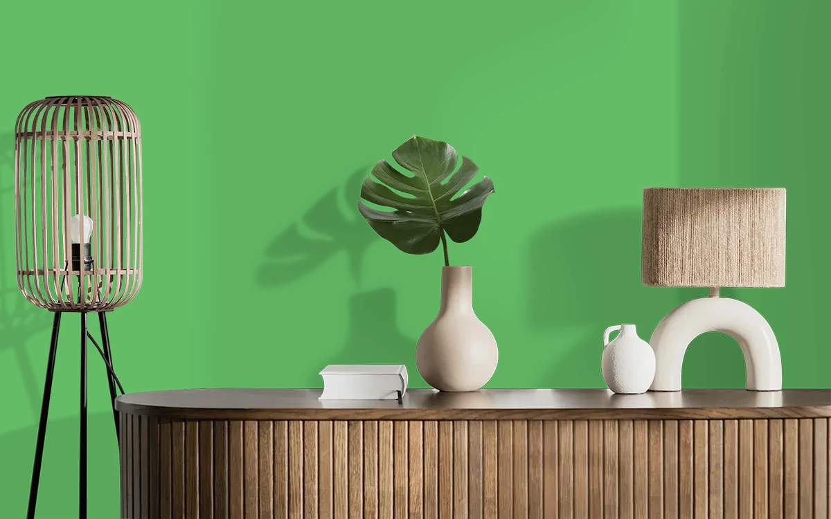 Nippon Paint's MATCHA GREEN color on different wall surfaces.