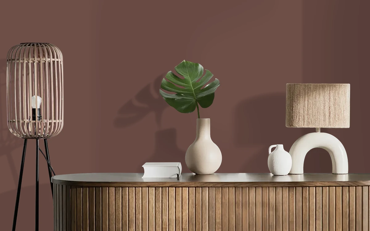 Nippon Paint's NEWTOWNE BROWN color on different wall surfaces.