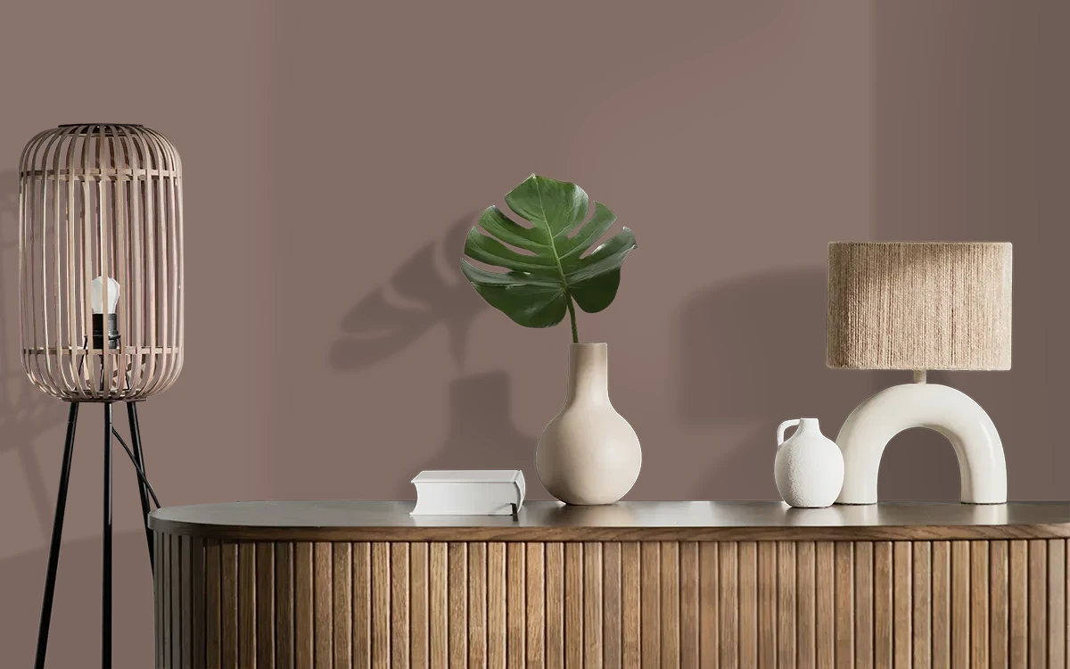 Nippon Paint's OLD BOOTS color on different wall surfaces.