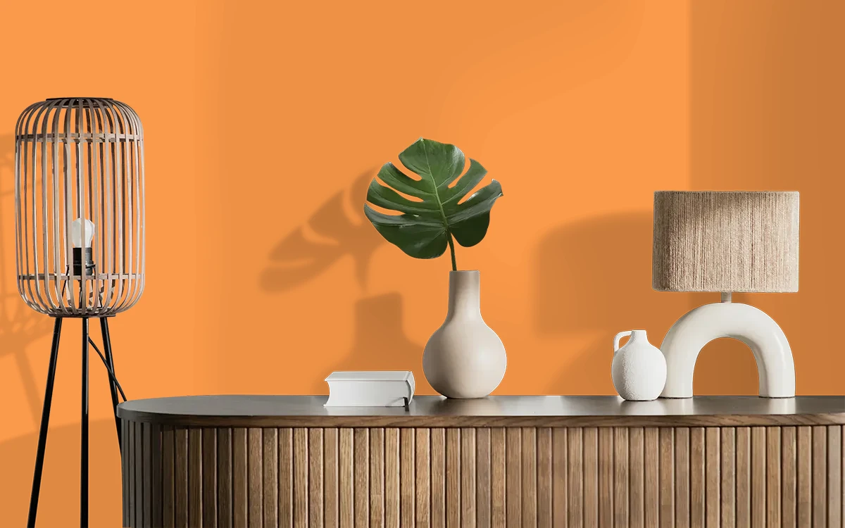 Nippon Paint's ORANGE BEDDER color on different wall surfaces.