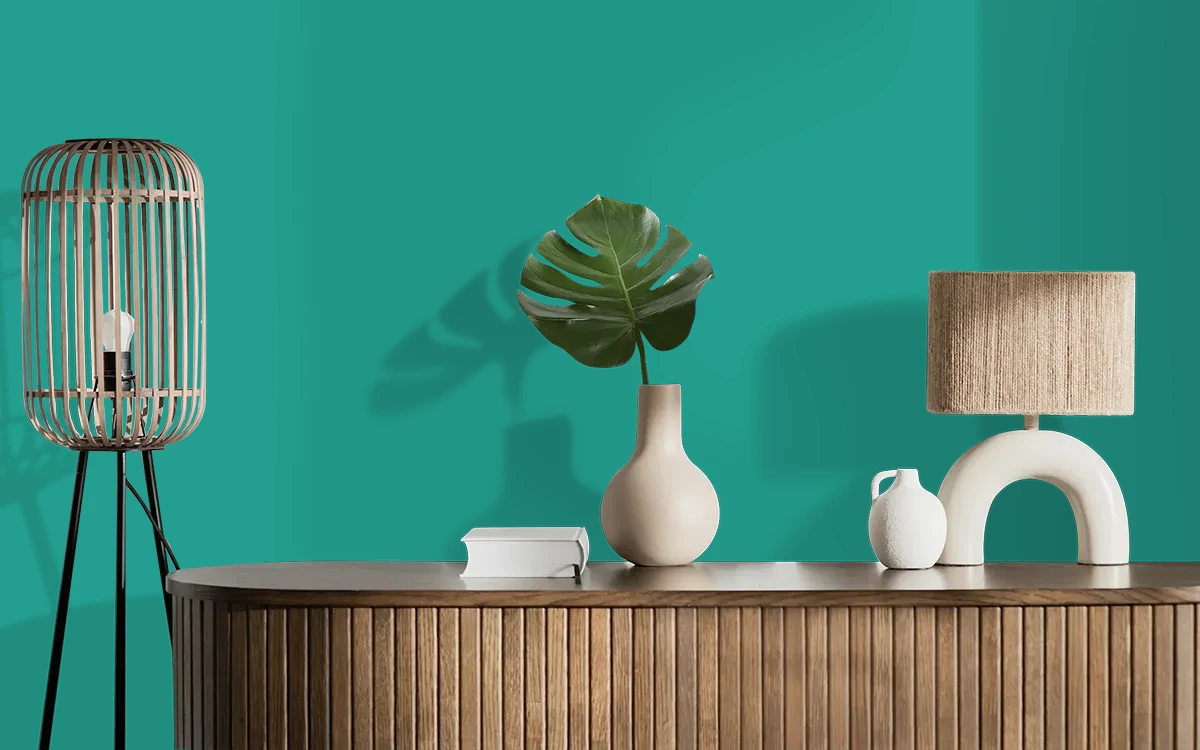Nippon Paint's PEACOCK'S PLUME color on different wall surfaces.