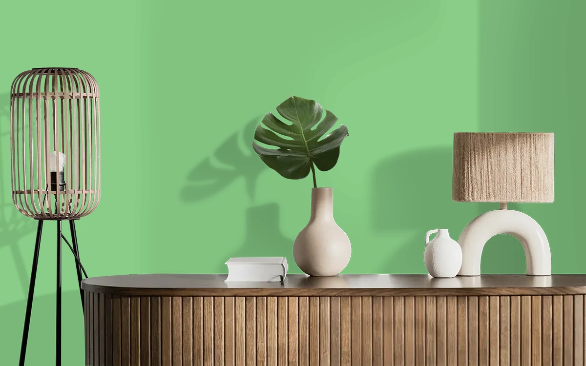 Nippon Paint's PICKING GREEN color on different wall surfaces.