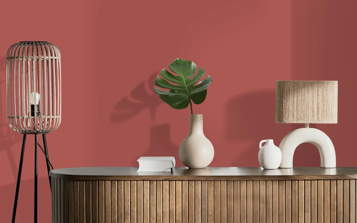 Nippon Paint's PIONEER RED color on different wall surfaces.
