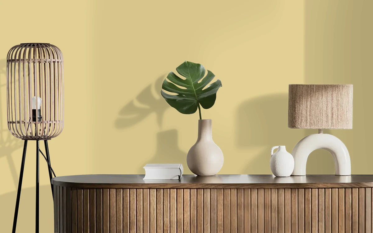 Nippon Paint's PRIMROSE PILL color on different wall surfaces.