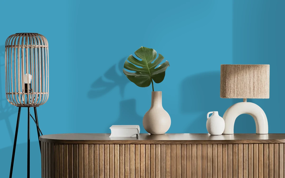 Nippon Paint's ROBIN'S GLOW color on different wall surfaces.