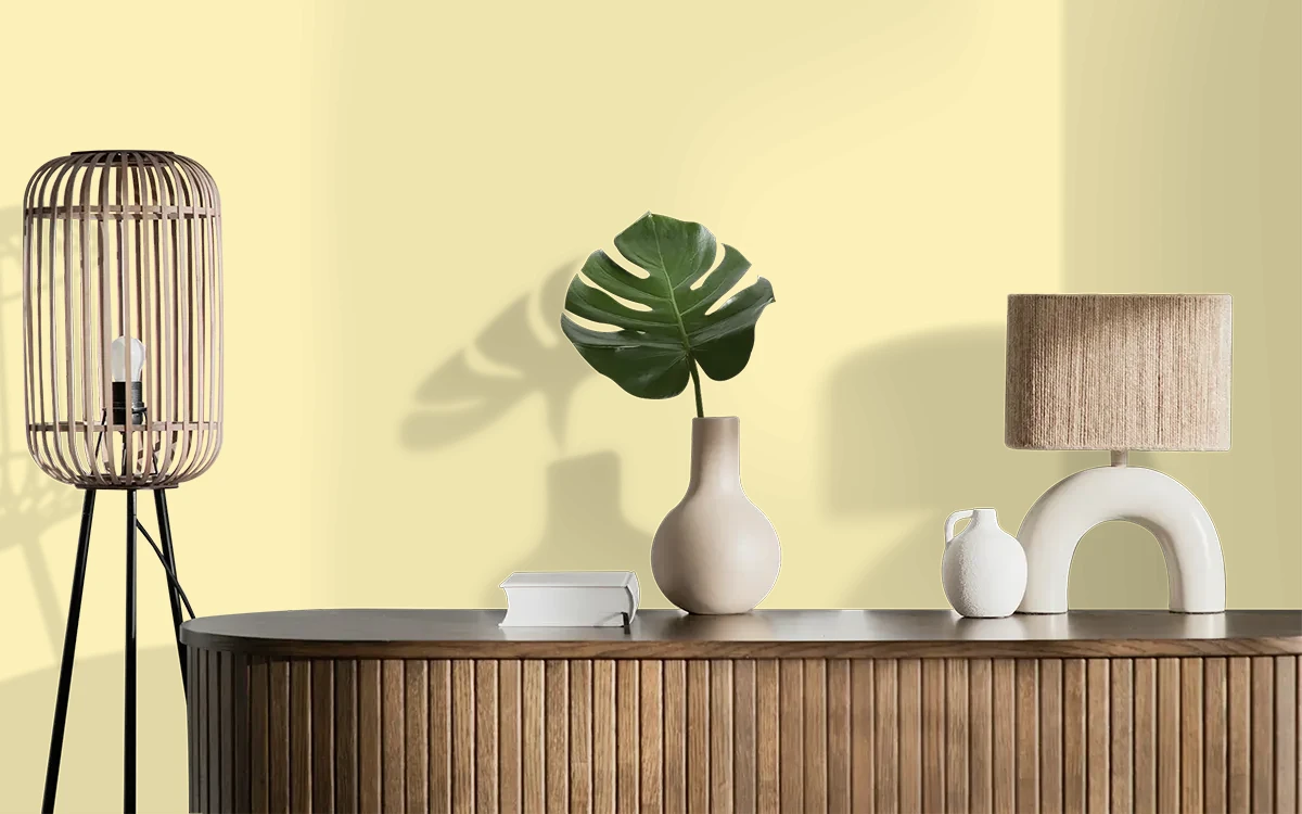 Nippon Paint's ROMAN CHAMOMILE color on different wall surfaces.