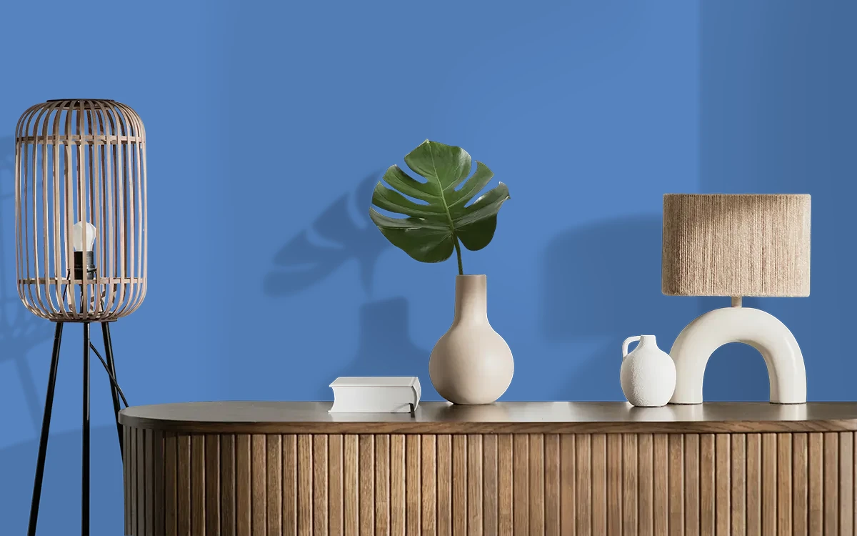 Nippon Paint's RUBIK'S BLUE color on different wall surfaces.