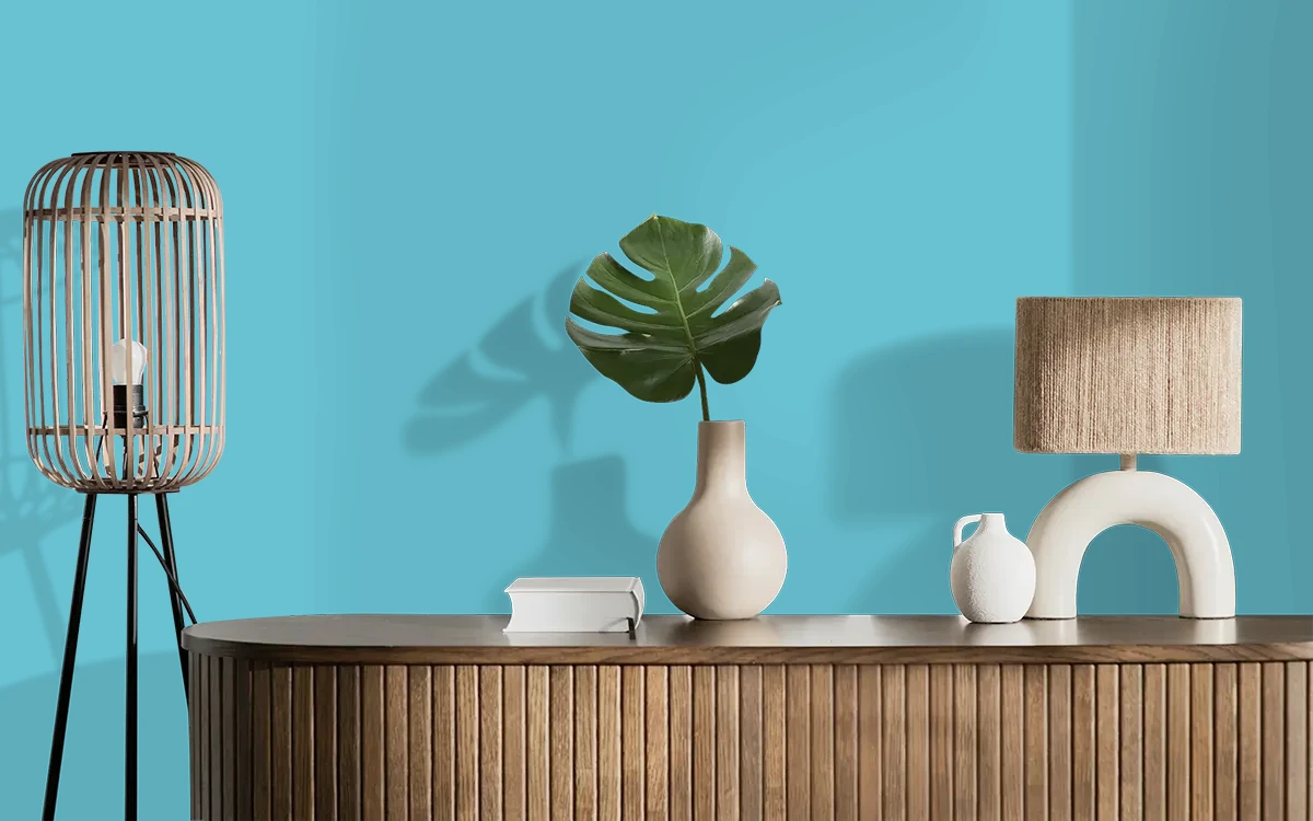 Nippon Paint's STRAIGHT CUT BLUE color on different wall surfaces.