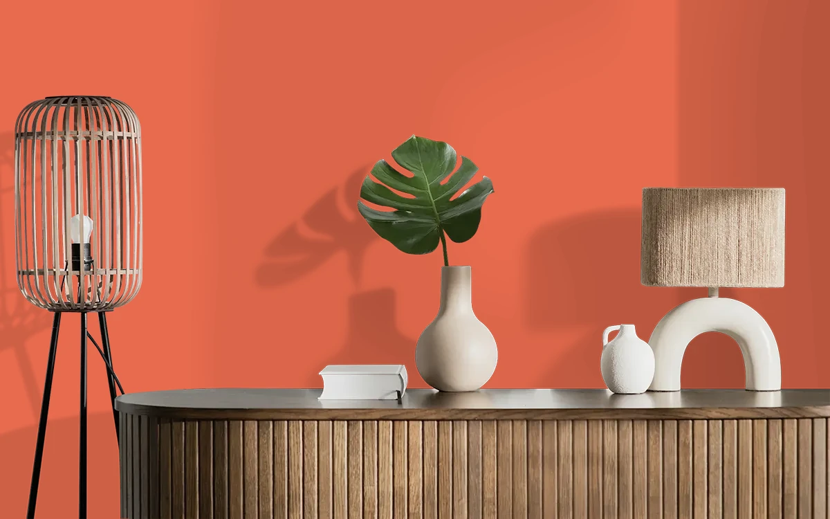 Nippon Paint's SUNKISSED TOMATO color on different wall surfaces.