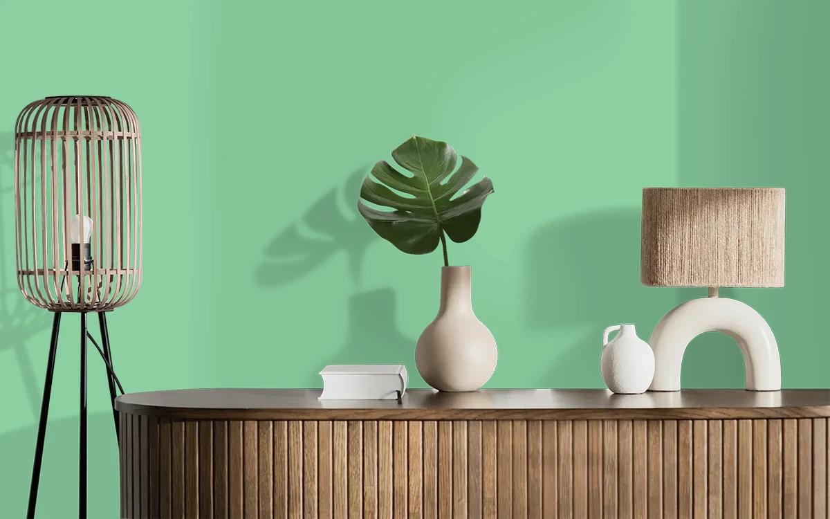 Nippon Paint's SURREY GREEN color on different wall surfaces.