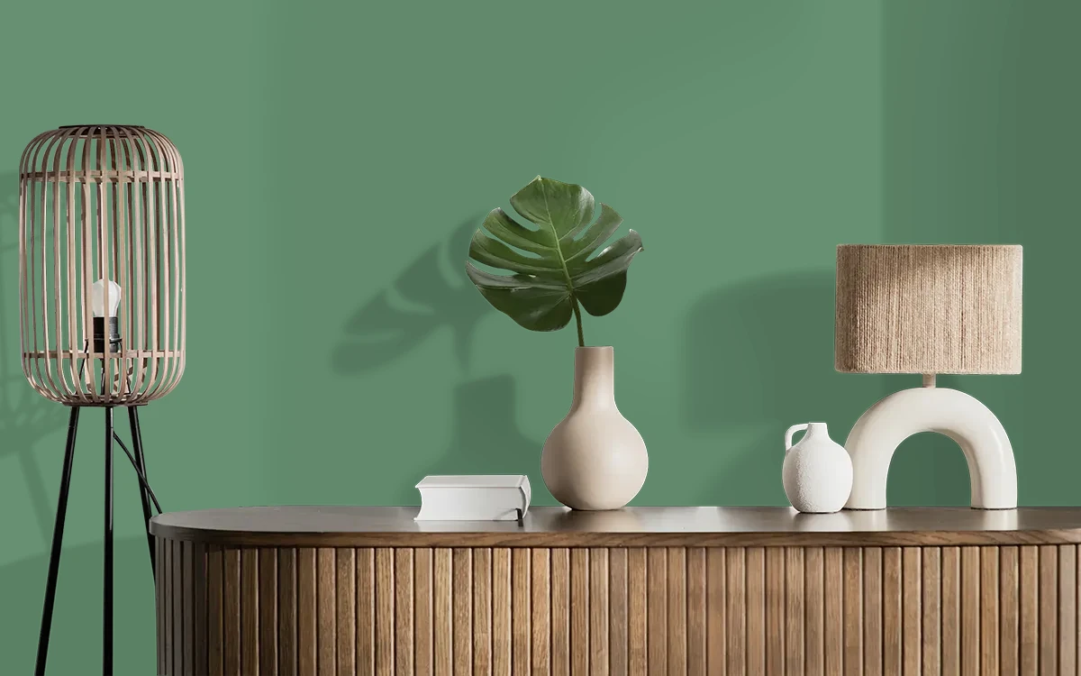 Nippon Paint's TERRESTRIAL GREEN color on different wall surfaces.