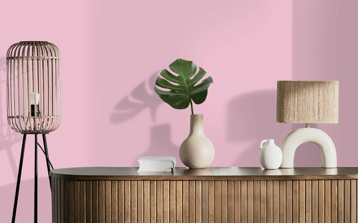 Nippon Paint's TICKLE PINK color on different wall surfaces.