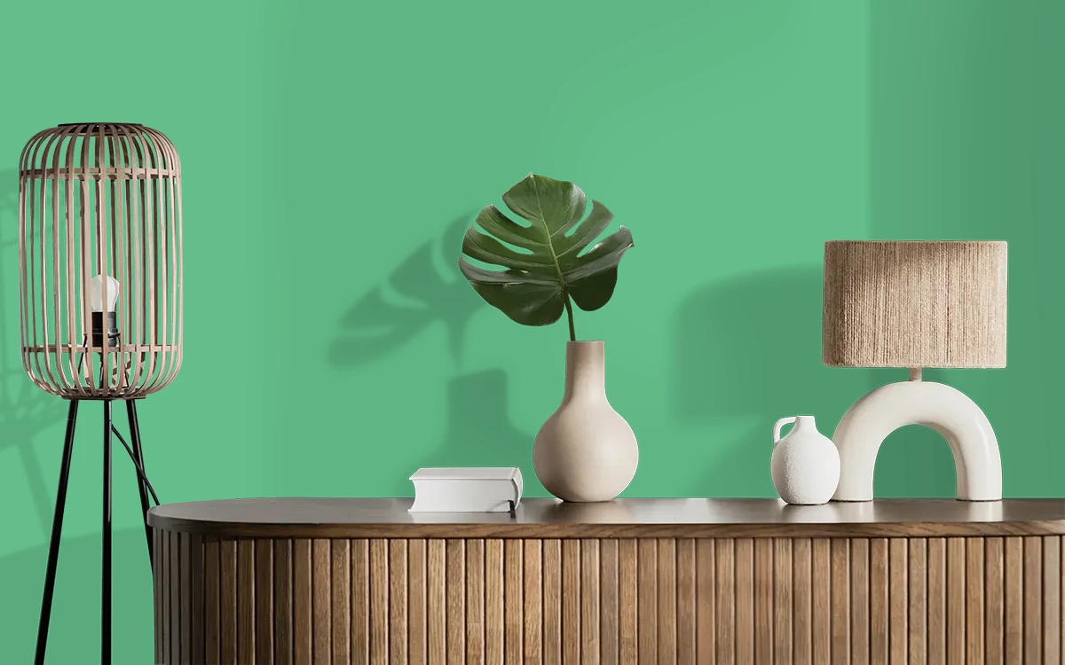 Nippon Paint's TIDAL GREEN color on different wall surfaces.