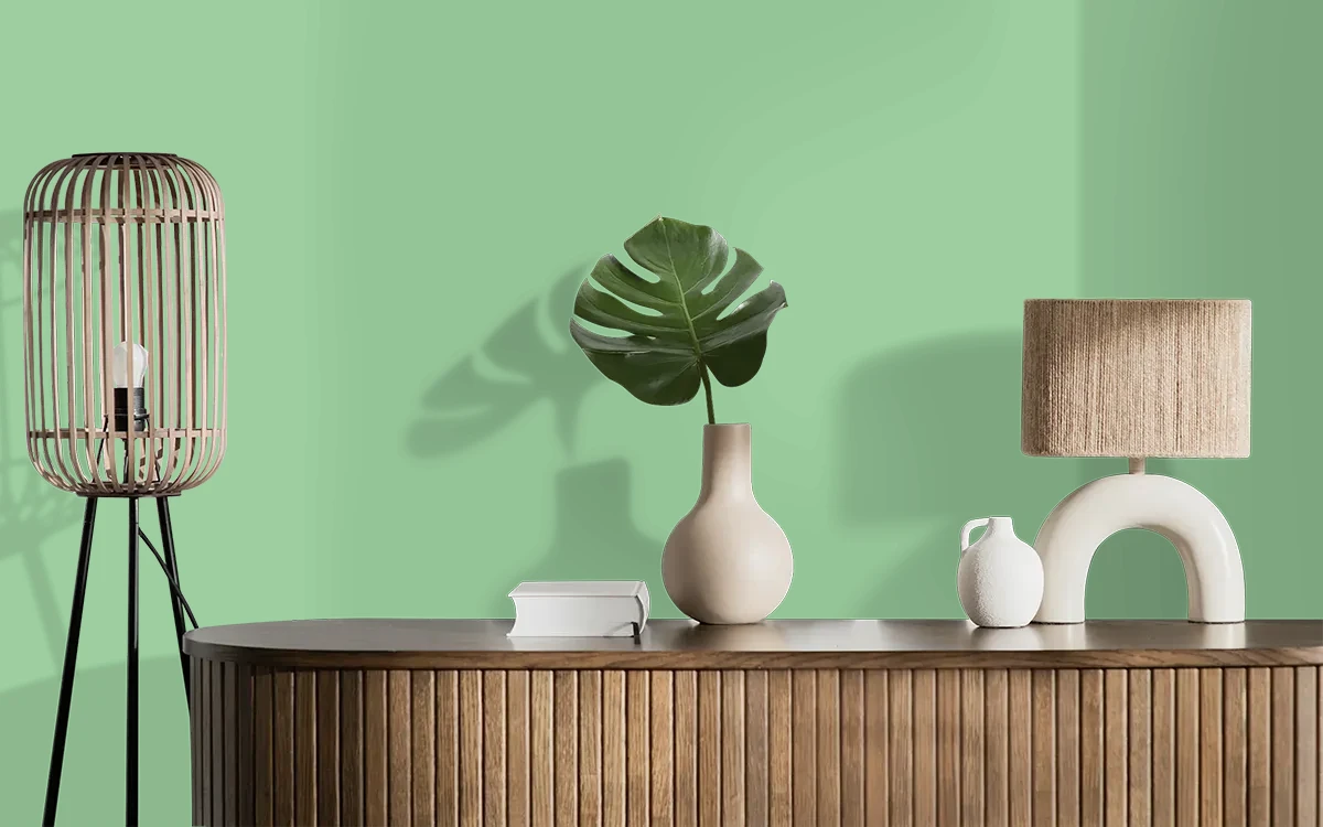 Nippon Paint's TROPICANA GREEN color on different wall surfaces.
