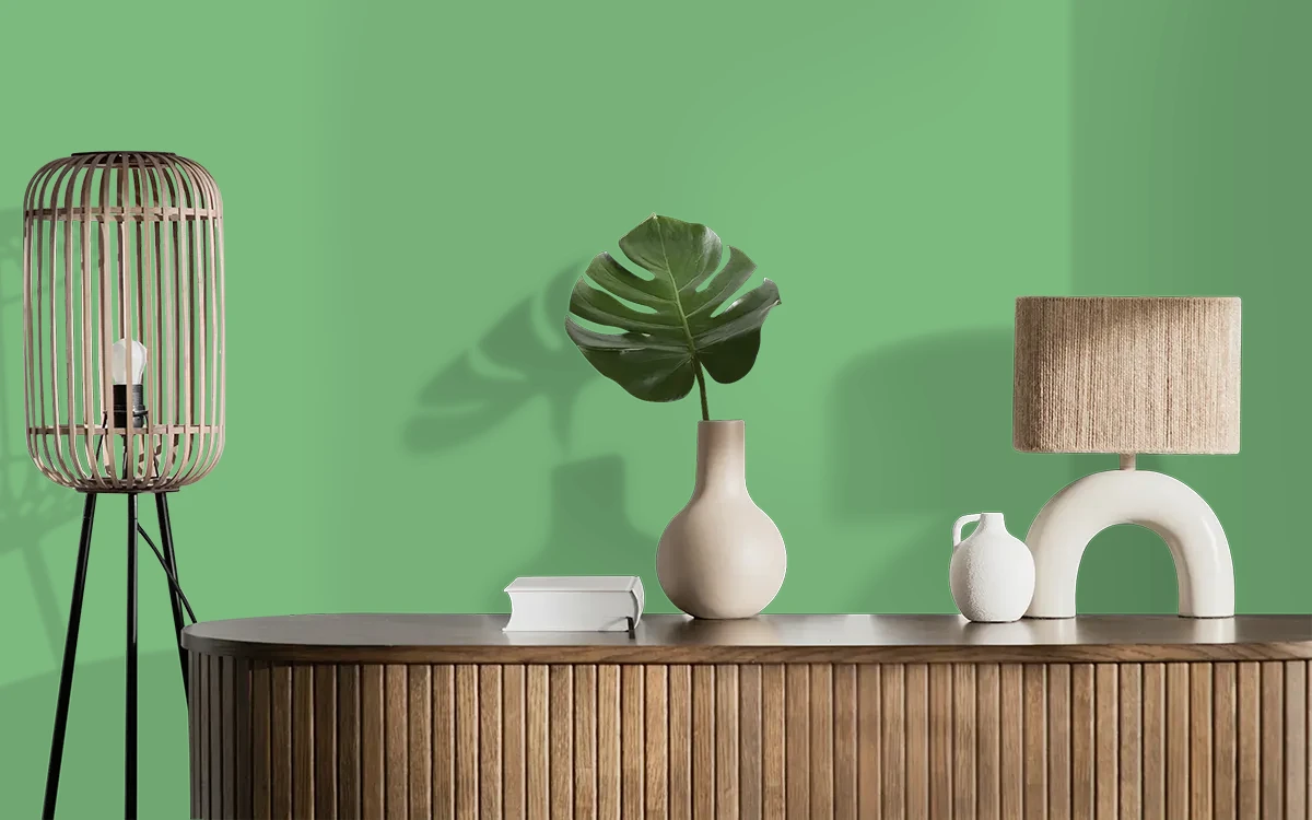 Nippon Paint's WISHING GREEN color on different wall surfaces.